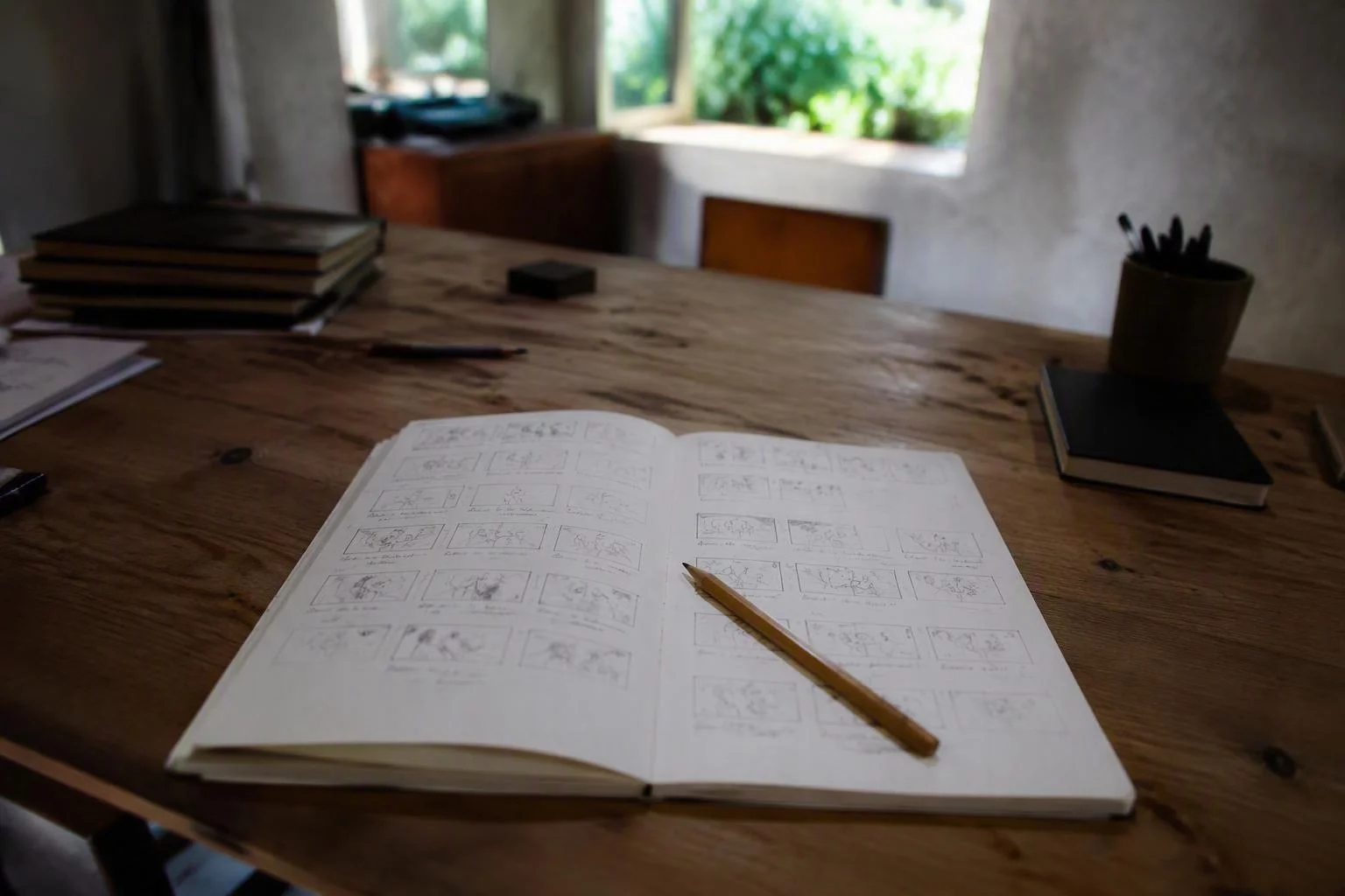 Caderno com a estrutura da abertura desenhada quadro a quadro